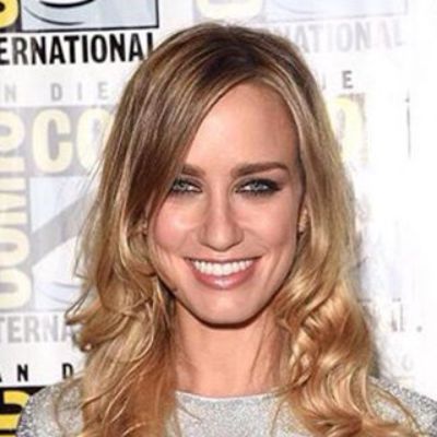 Ruta Gedmintas posing for a photo shoot with a cute smile.